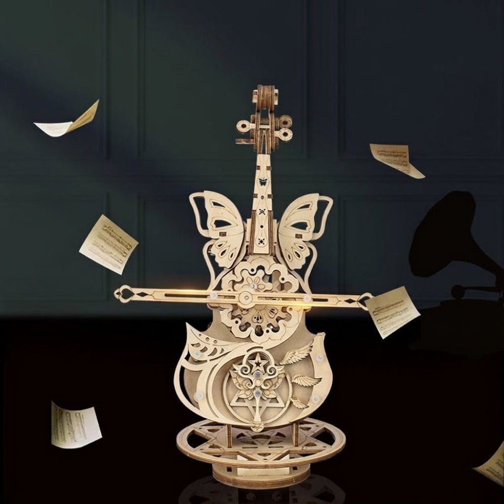 Boîte à musique violoncelle entourée de feuilles de partition qui volent