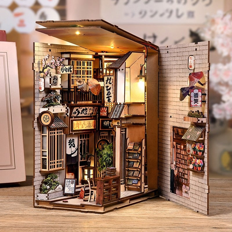 Book nook chat ruelle japonaise photographié panneau latéral ouvert