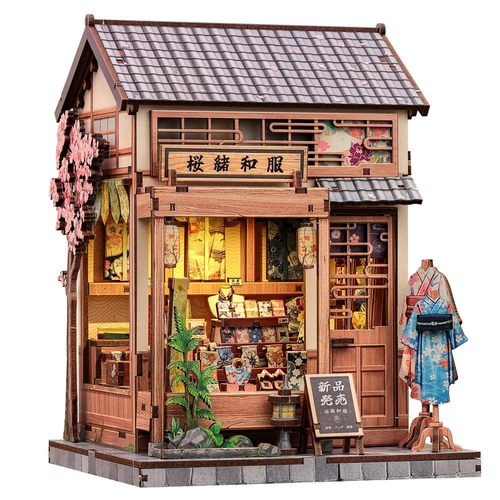 Book nook japonais boutique de kimonos en bois, vue de trois quarts sur fond blanc