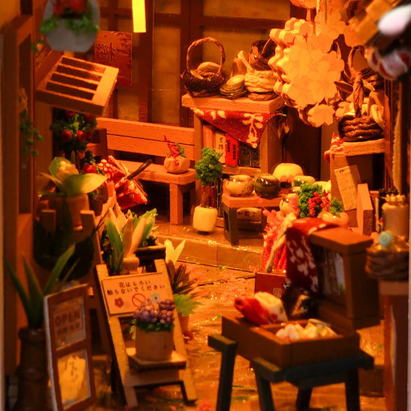 Nahaufnahme des Blumenladens und der Möbel im Book Nook japanische Gasse