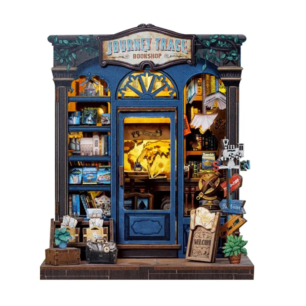 Book nook librairie du voyage vu de face : vitrine éclairée, panneaux de direction et soubassement