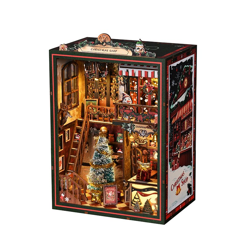 Book nook Noël boutique de cadeaux en bois, vue de trois quarts sur fond blanc