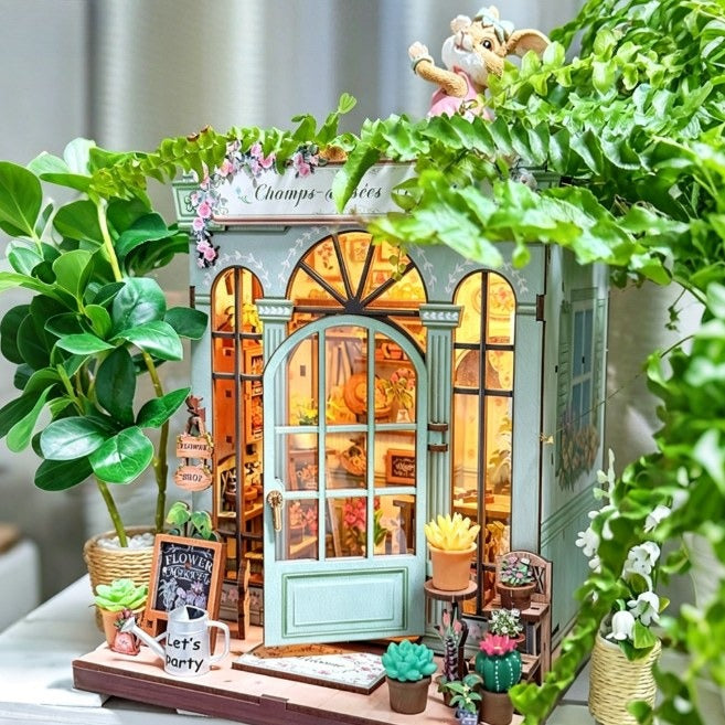 Book nook fleuriste parisien entouré de plantes vertes